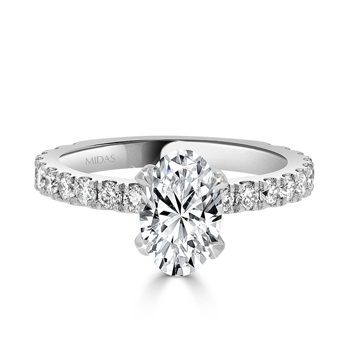 Oval Cut with Four Claw Set Diamond Engagement Ring