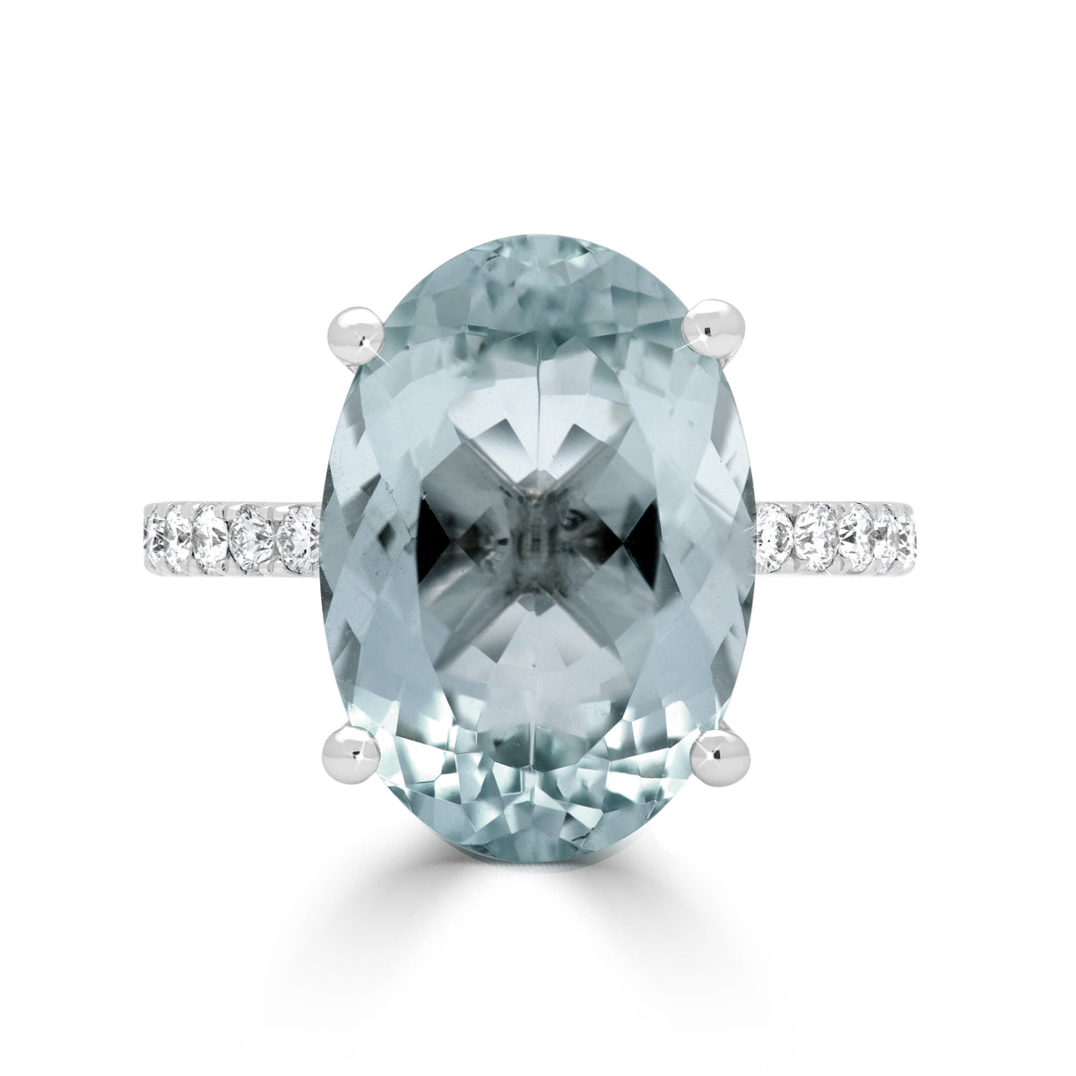 Oval Cut Aquamarine and Round Brilliant Diamond Claw Set Dress Ring