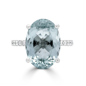 Oval Cut Aquamarine and Round Brilliant Diamond Claw Set Dress Ring