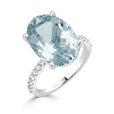 Oval Cut Aquamarine and Round Brilliant Diamond Claw Set Dress Ring