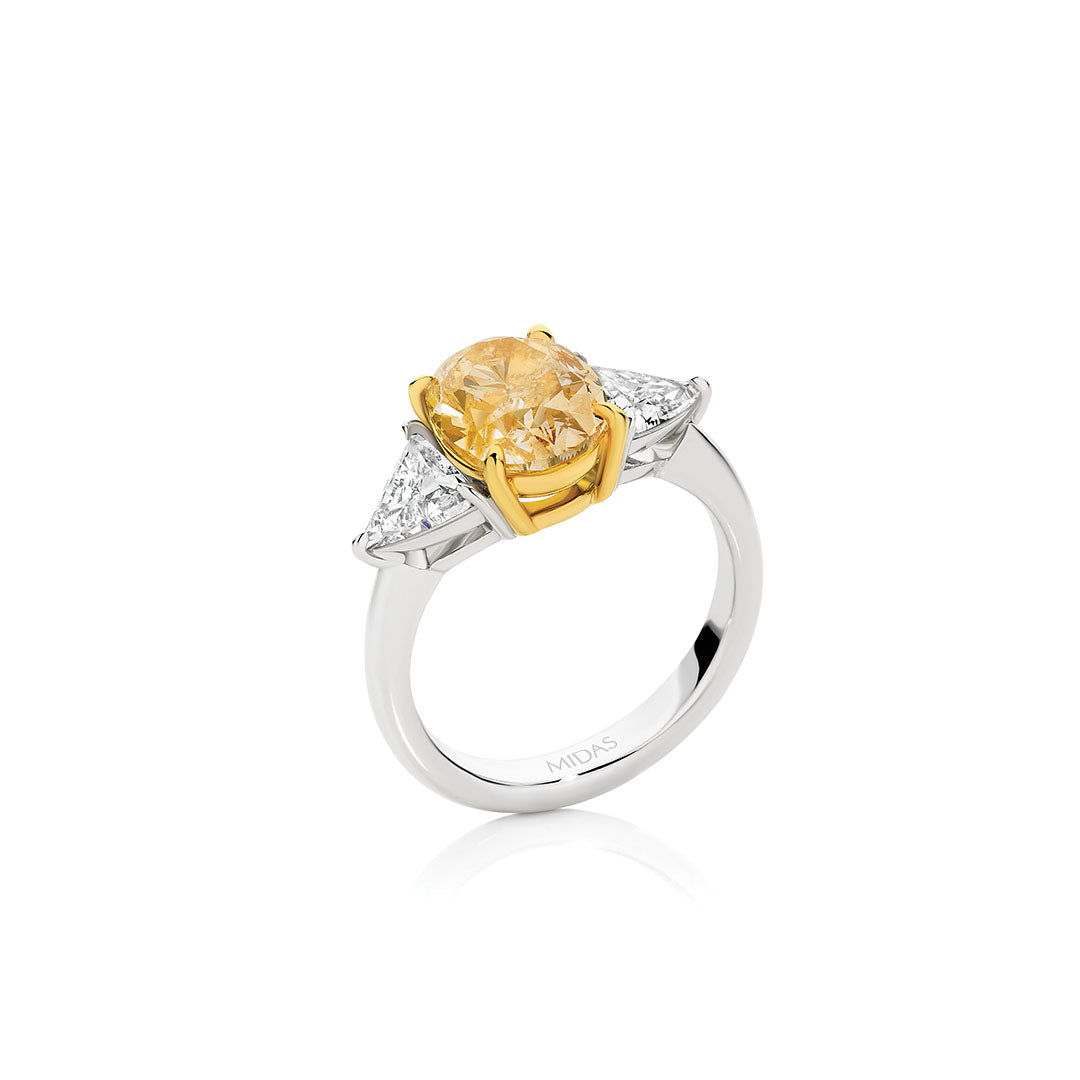 Oval Cut Yellow Diamond and Trilliant Cut Diamond Engagement Ring