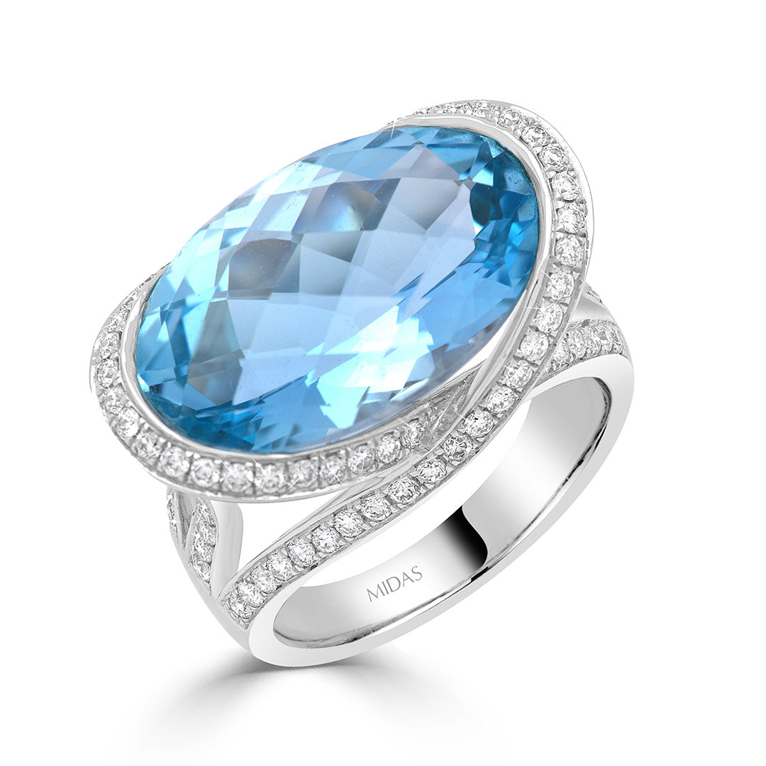 Oval Cut Blue Topaz and Diamond Halo Dress Ring