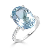 Oval Cut Aquamarine and Round Brilliant Diamond Claw Set Dress Ring