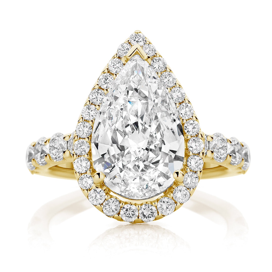 Delicate Pear with Round Halo and Cathedral Band