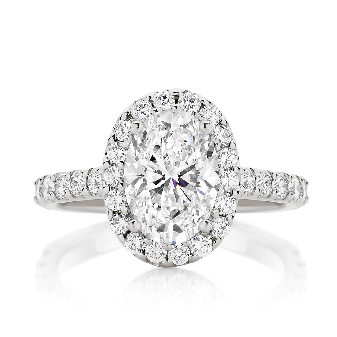 Oval Cut Engagement Ring With Seamless Claw Set Halo