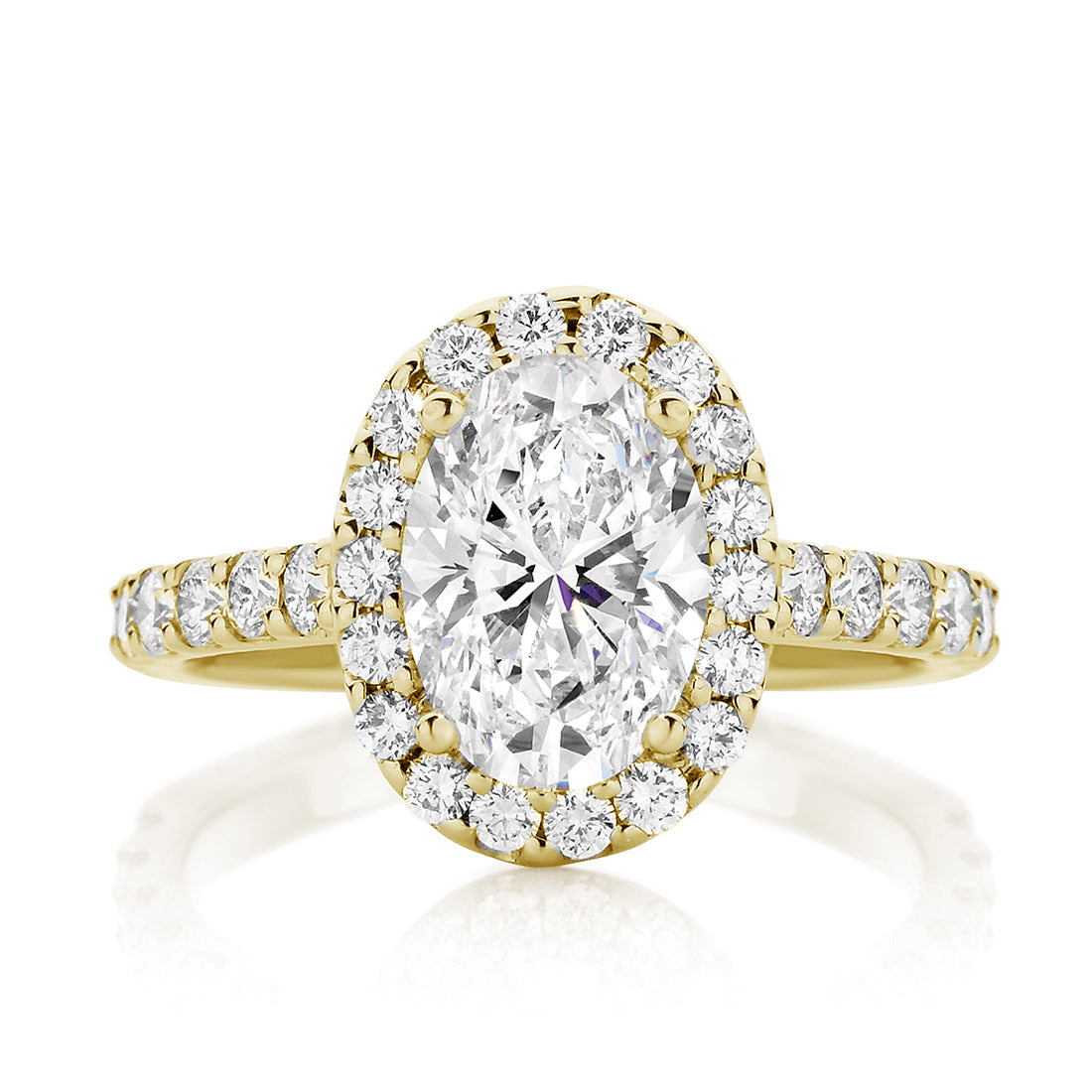 Oval Cut Engagement Ring With Seamless Claw Set Halo